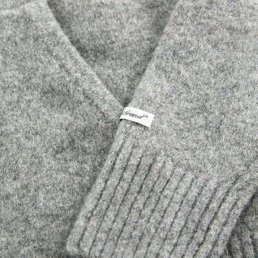 The label of the about:blank Mohair Knitted Logo Grey Hoodie.