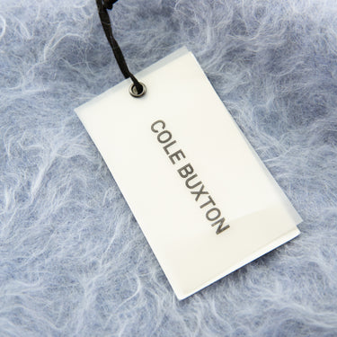 The tag of the Cole Buxton Baby Blue Alpaca Crew Knit Sweat.