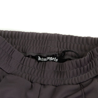 The inside tag of the Palm Angels Grey & Pink Sweatpants.