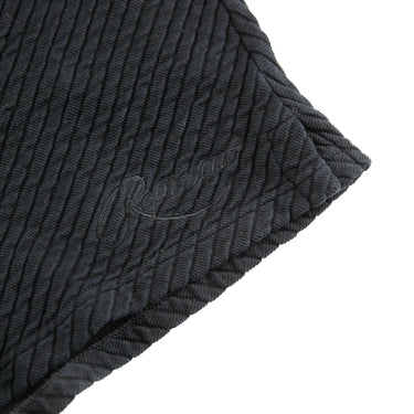 The detail of the Represent Black Ottoman Shorts.