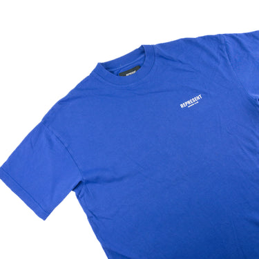 The flat of the Represent Owners Club Blue T Shirt.