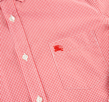 The logo of the Burberry Check Red Button Up Shirt.