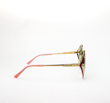 The right side of Dior Enamel Sunglasses showing the gold, red and pink frame with custom sage green gradient lenses.
