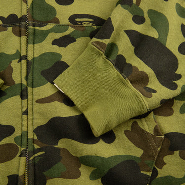 The sleeve of the A Bathing Ape Green Camo Shark Full Zip Hoodie.