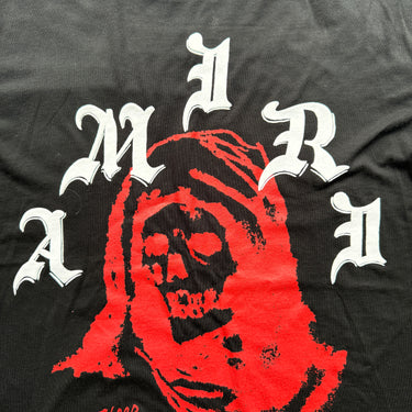 The logo of the Amiri Wes Lang Solar Kings Black T Shirt.