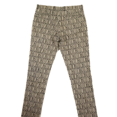 The back view of Dior x Stussy All Over Jeans in beige showcasing a unique all-over design.