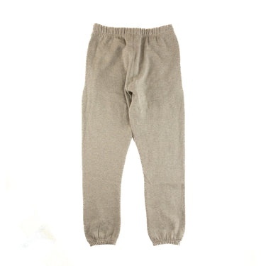 The back of the Fear Of God ESSENTIALS Dark Oatmeal Sweatpants.