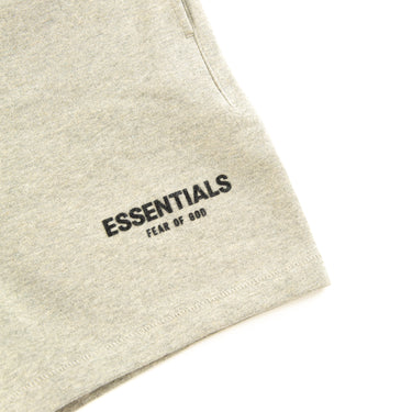 The logo of the Fear Of God ESSENTIALS Dark Oatmeal Shorts.