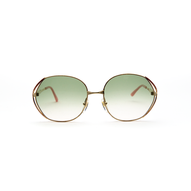 The front of Dior Enamel Sunglasses with custom sage green gradient lenses in gold, red, pink and sage green.