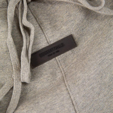 The logo of the Fear Of God ESSENTIALS Dark Oatmeal Sweatpants M.
