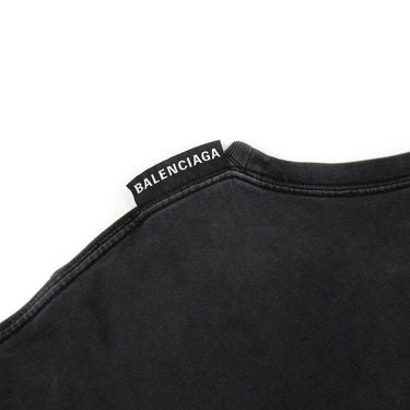 The Balenciaga shoulder tag displaying the brand logo with subtle luxury.