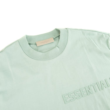 The collar of the Fear Of God ESSENTIALS Sycamore T Shirt.
