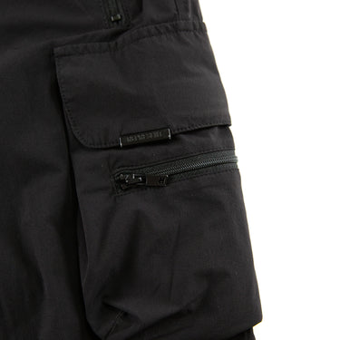 The pocket of the Represent Black Cargo Trousers.