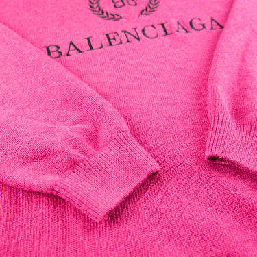 The sleeve of the Balenciaga BB Crest Pink Turtle Neck Sweater.