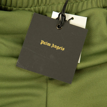 The tag of the Palm Angels Military Green and Purple Sweatpants.