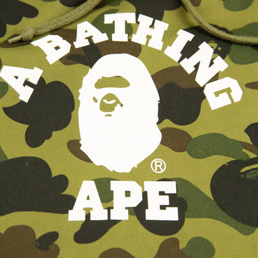 The logo of the A Bathing Ape 1st Camo Green College Hoodie.