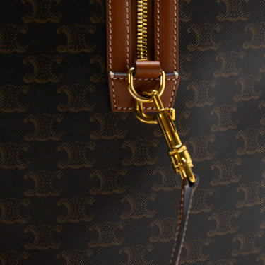 The zip of the Celine Voyage bag in Triomphe Canvas with Celine print.