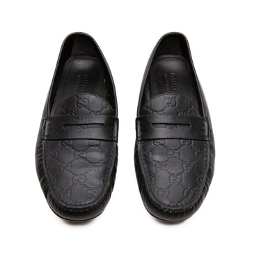 The top view of Gucci Black Loafers, showcasing its smooth black finish.