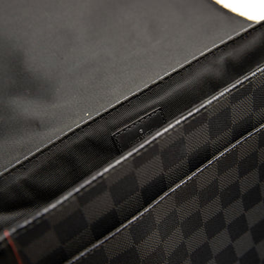 The inside of the Louis Vuitton District Messenger Damier Graphite Alps PM.