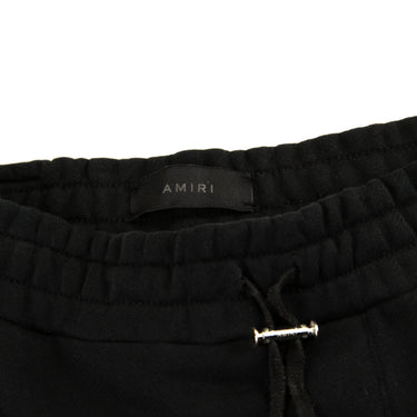 The inside label of the Amiri Black Shorts.
