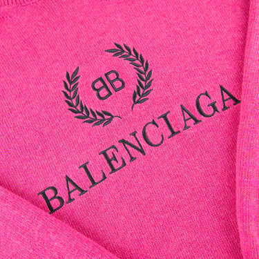 The logo of the Balenciaga BB Crest Pink Turtle Neck Sweater.