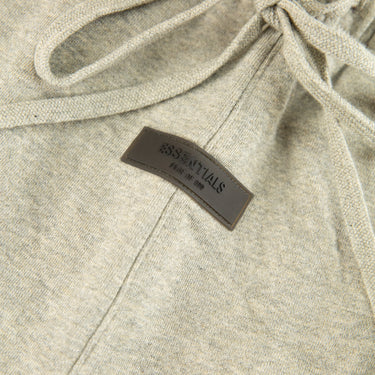 The front of the Fear Of God ESSENTIALS Dark Oatmeal Shorts.