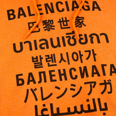 The logo of the Balenciaga Orange Languages Hoodie.