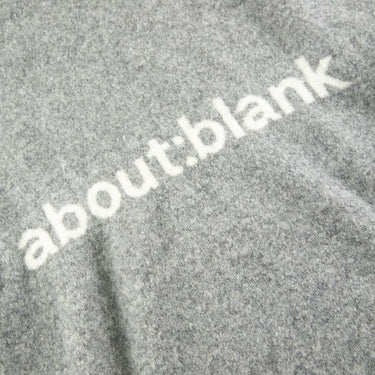 The logo of the about:blank Mohair Knitted Logo Grey Hoodie.