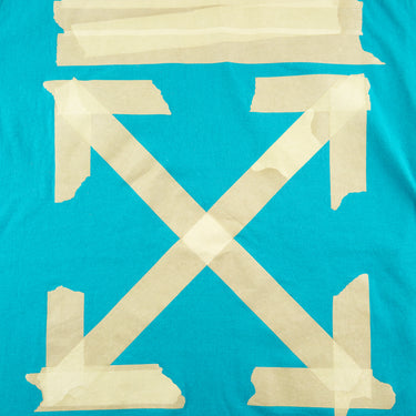 The back logo of the Off-White Tape Arrows Teal T Shirt.