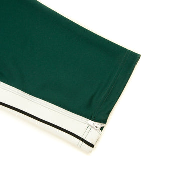 The leg of the Palm Angels Pine Green Sweatpants.