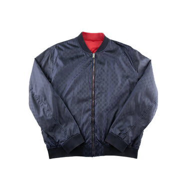 The one side of the Gucci Monogram Reversible Bomber.