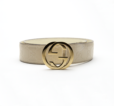 The front of the Gucci Cream & Gold Leather Belt showing the logo.