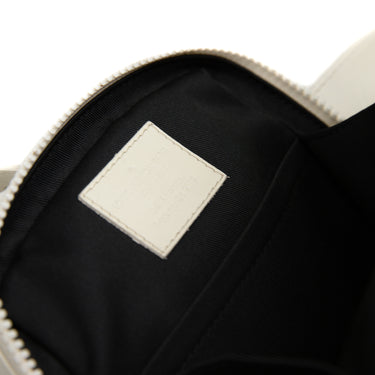 The inside label of the Louis Vuitton 2018 Utility Belt Bag White Leather.