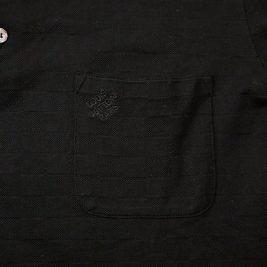 The front logo of the Louis Vuitton Black Polo Shirt.