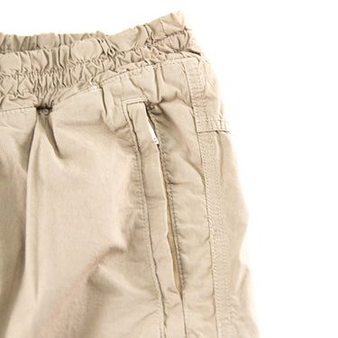The pocket of the Represent Beige Cargo Trousers.