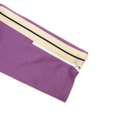 The leg of the Palm Angels Dark Purple Sweatpants L.