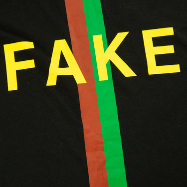 The flat lay of the Gucci Fake Not Black T Shirt.