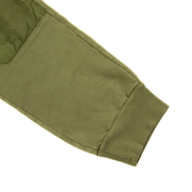 The leg of the C.P. Company Diagonal Fleece Mixed Lens Khaki Sweatpants.