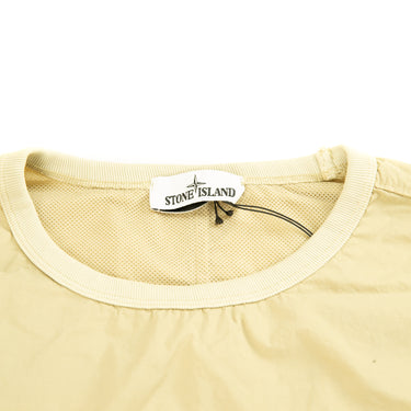 The inside label of the Stone Island Naslan Light Crewneck Beige Sweatshirt.