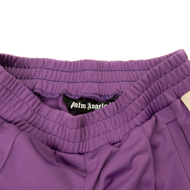 The inside label of the Palm Angels Dark Purple Sweatpants L.
