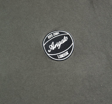 The logo of the Axel Arigato Dunk Grey T Shirt.