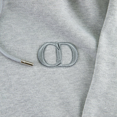 The logo of the Dior CD Icon Grey Hoodie.