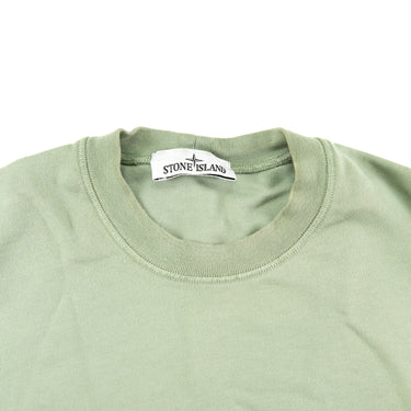 The inside label of the Stone Island Sage Crew Neck Sweater.