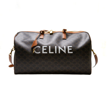 The front of the Celine Voyage bag in Triomphe Canvas with Celine print.