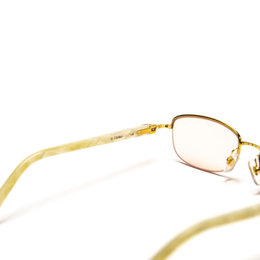 The lens of the Cartier 22ct Gold Plated C de Cartier White Acetate Sunglasses.