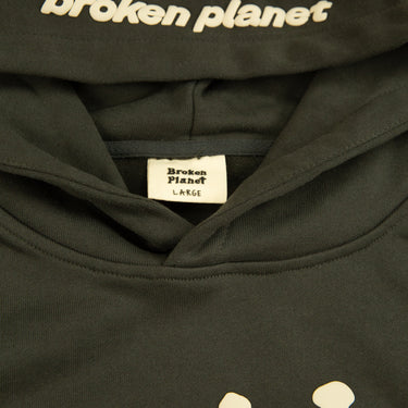 The inside label of the Broken Planet Far Side Of The Moon Grey Hoodie.