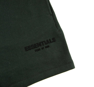 The logo of the Fear Of God ESSENTIALS Stretch Limo Sweatshorts.