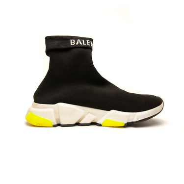 The left of the Balenciaga Speed Trainers.