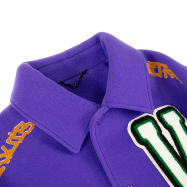 The collar of the Louis Vuitton Multi-Patches Mixed Leather Varsity Jacket.