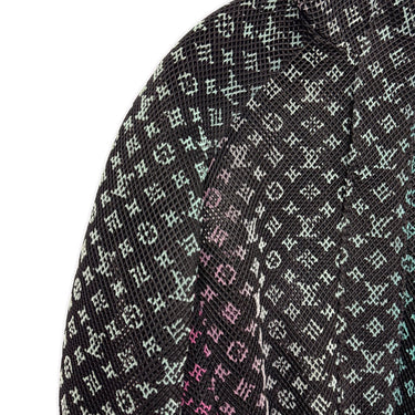 The logo of the Louis Vuitton Rainbow Gradient Mesh Bomber Jacket.